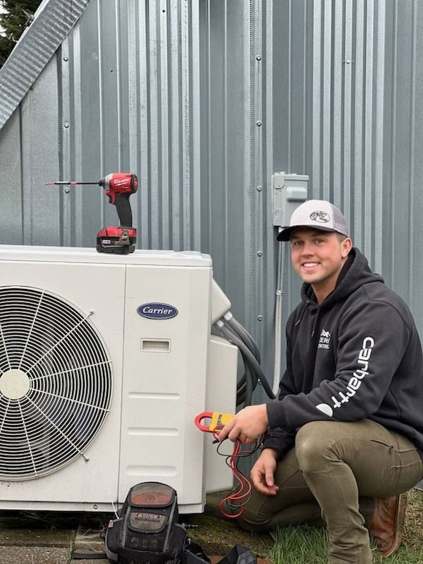 Sub Zero technician next to an outdoor unit