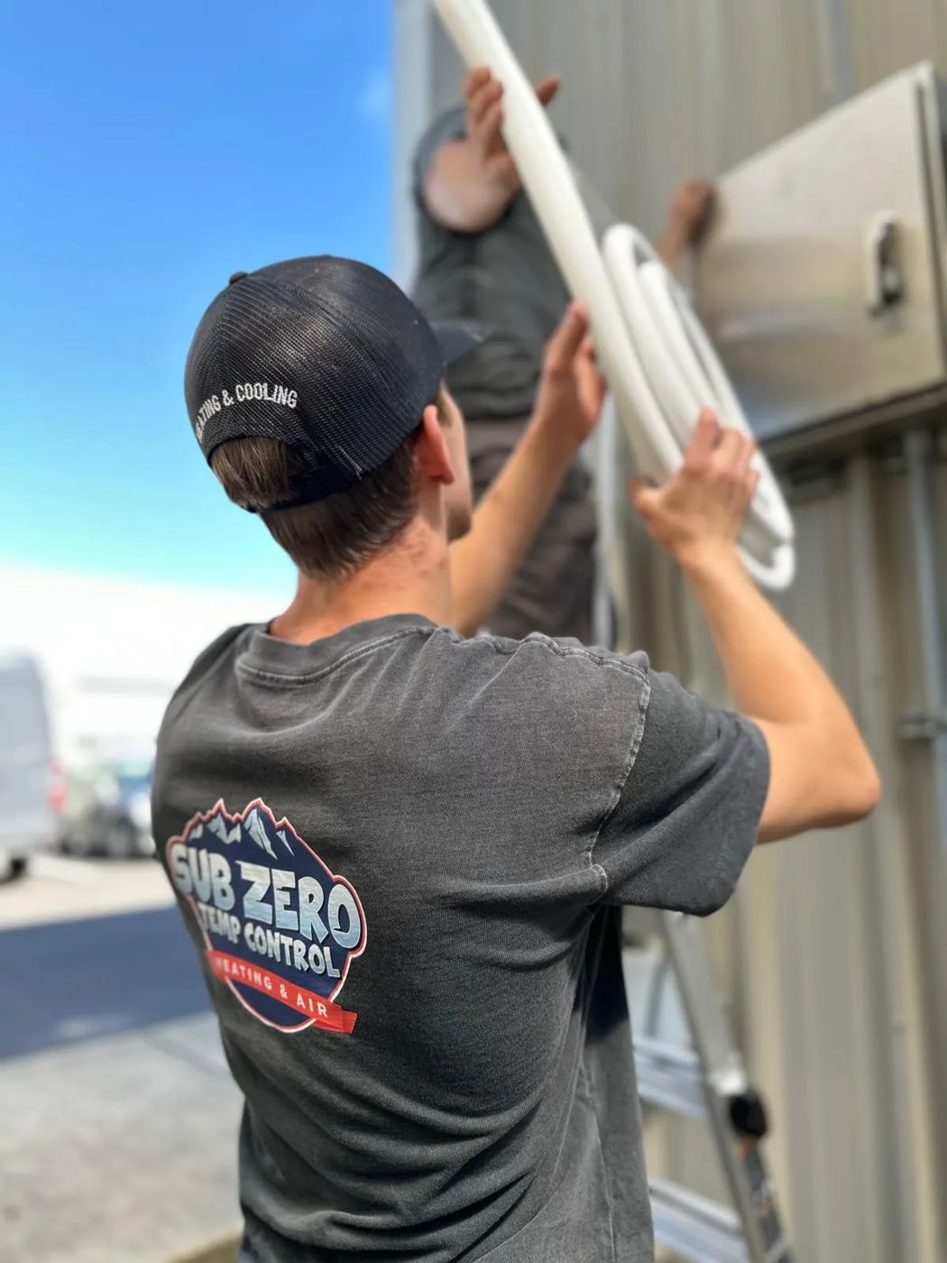 Sub Zero Temp Control technician servicing a rooftop HVAC unit in Vancouver, WA
