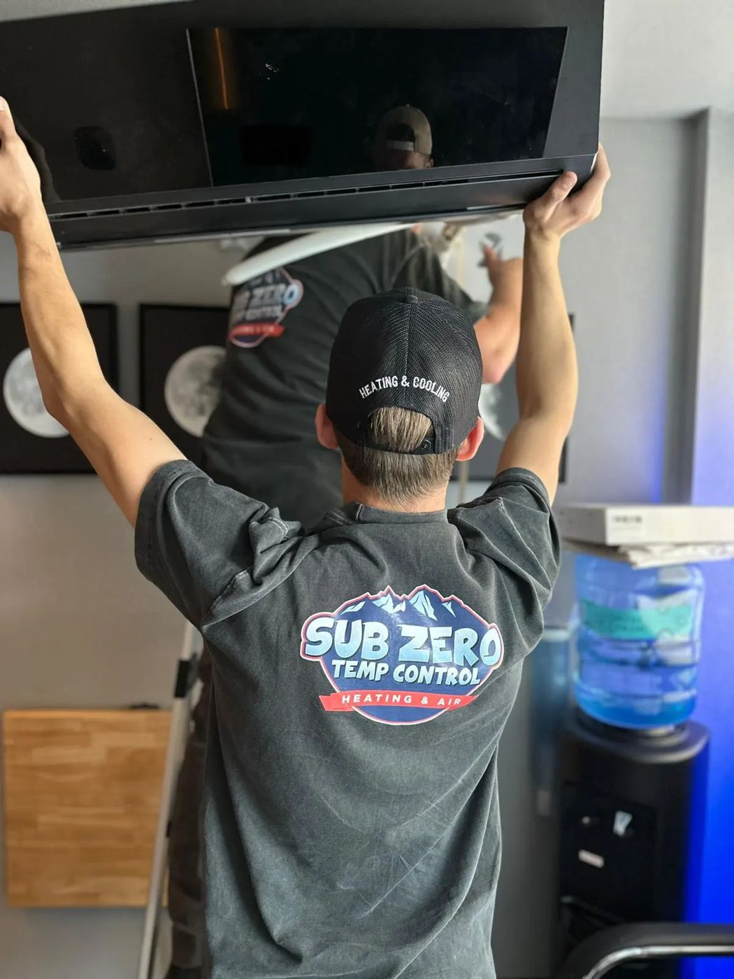 Technician working on indoor equipment